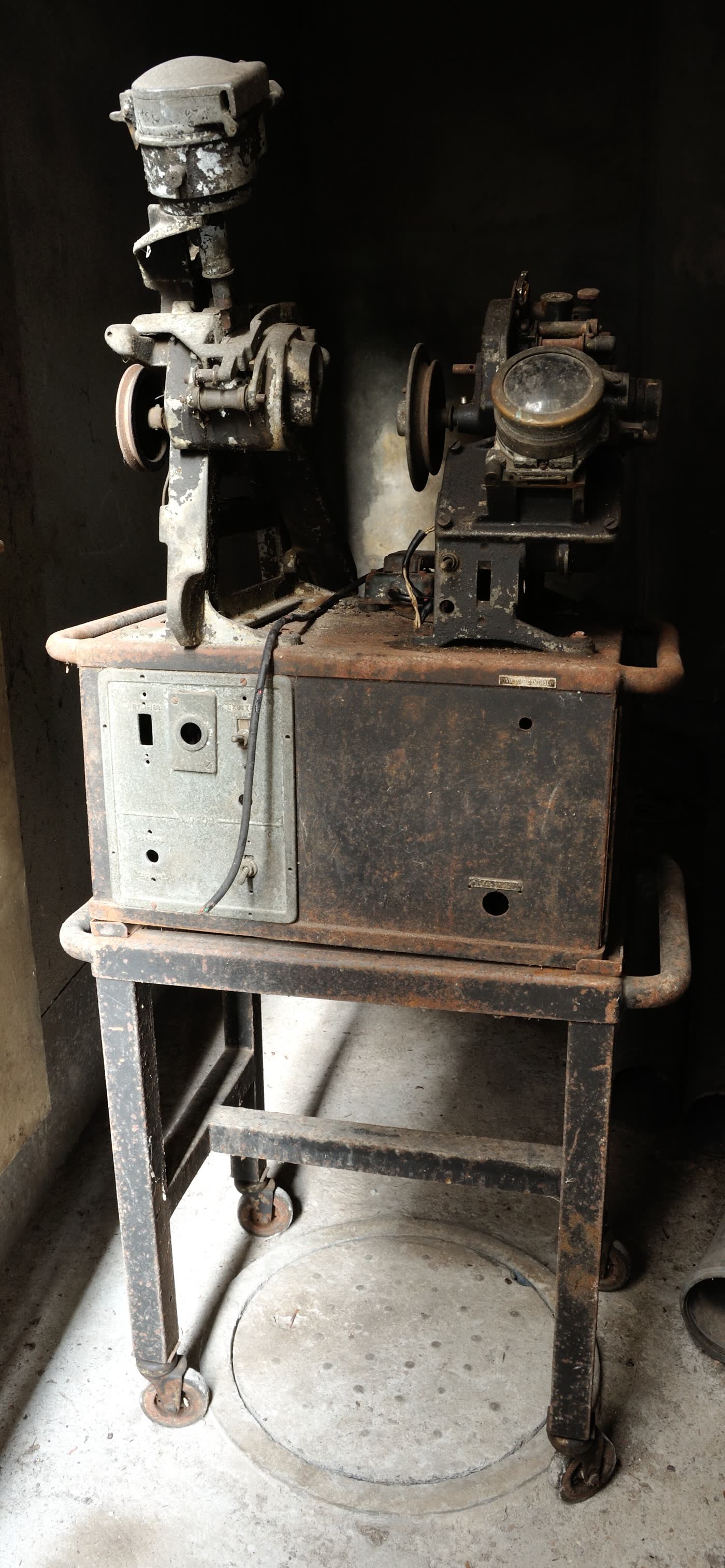 An old Moviola 35mm film editing machine on a steel stand