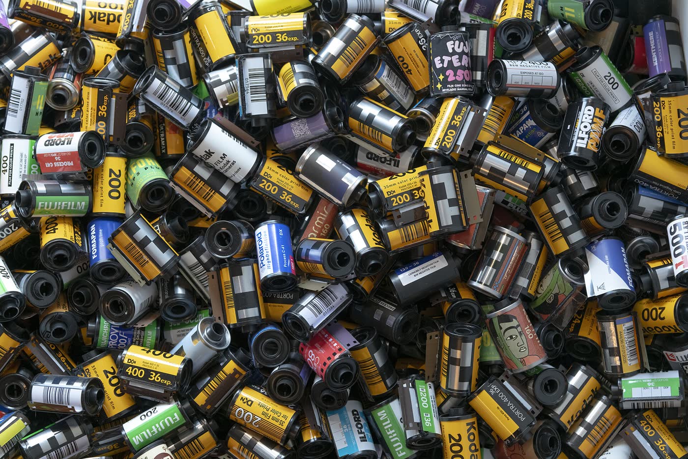 A heap of used 35mm film cartridges